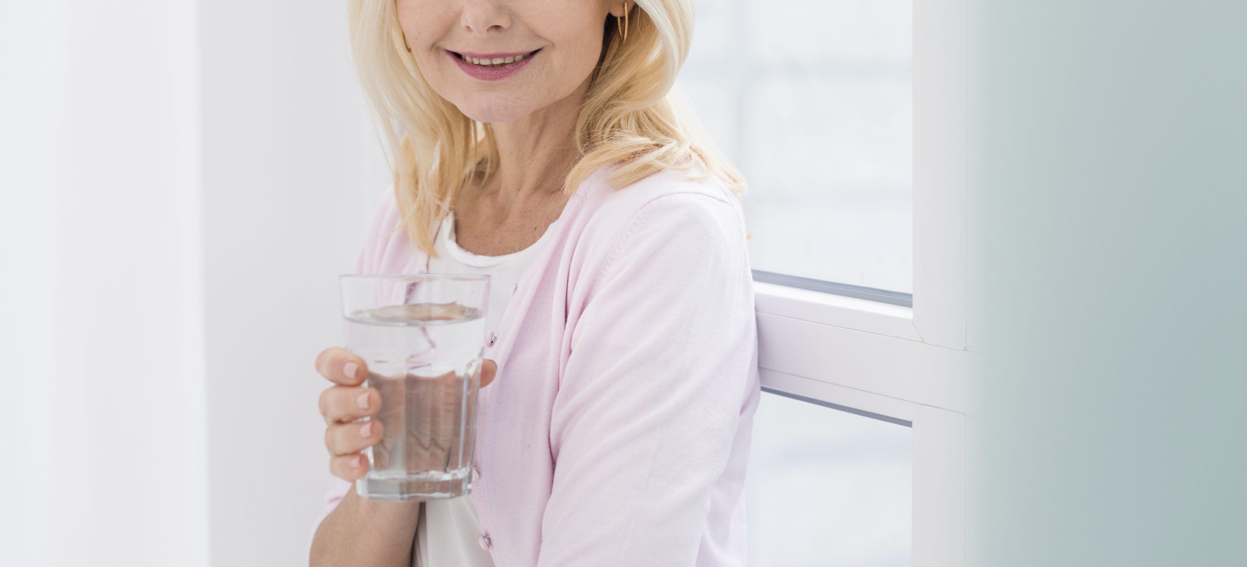 portrait-pretty-mature-woman-holding-glass-water